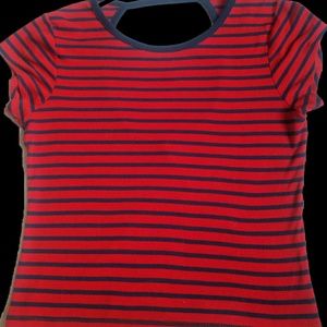 Striped res and blue backless shirt.
